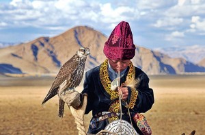 Mongolian kid with his falcon